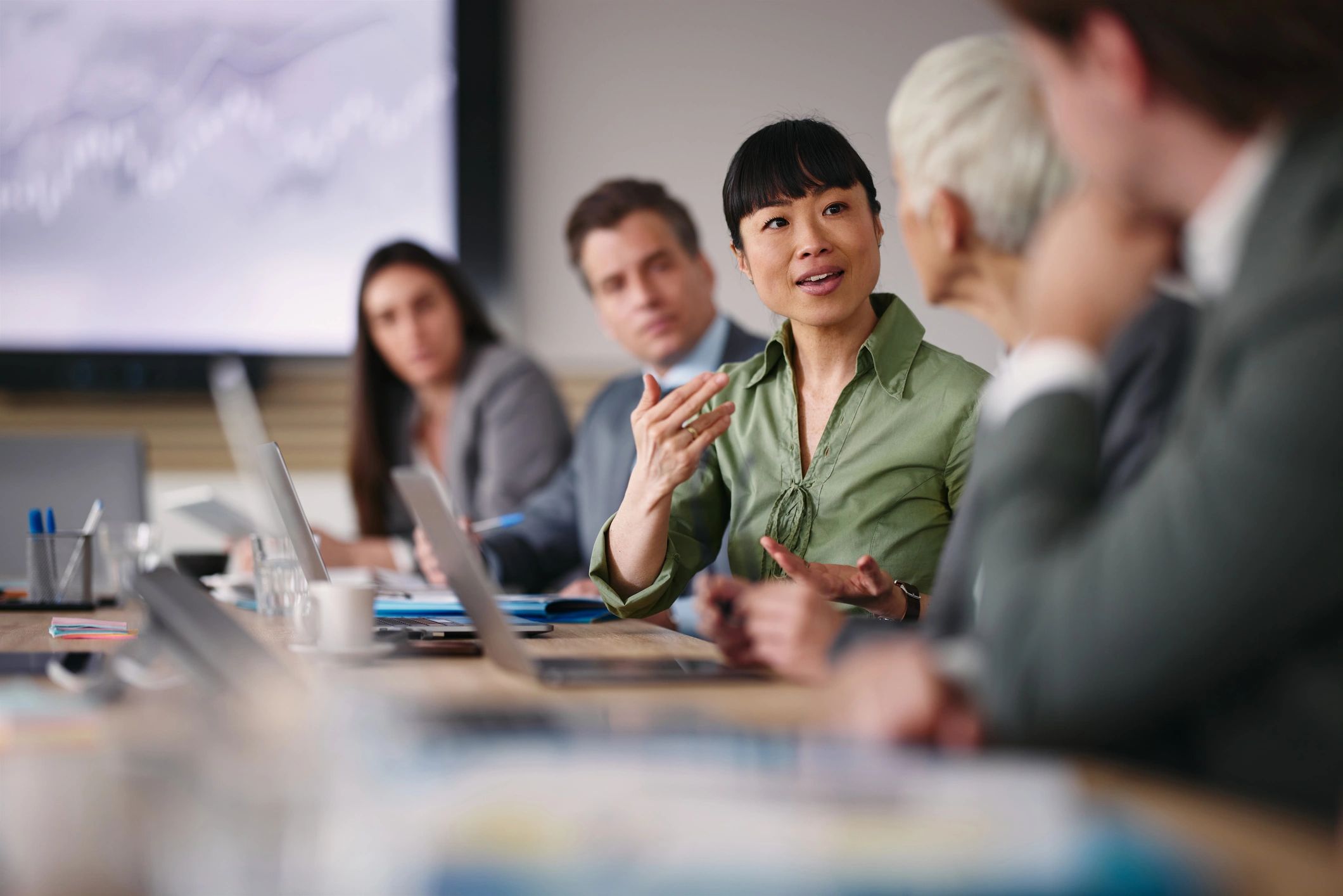 Businesswoman speaking with a colleague during an office meeting