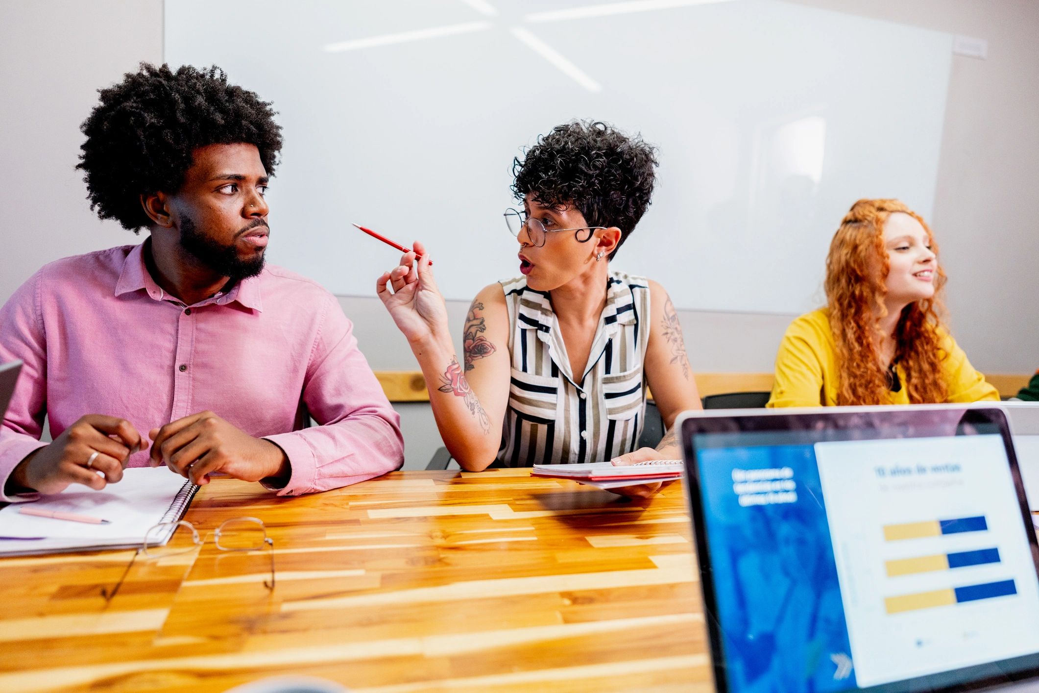 Coworkers talking during a meeting at the office