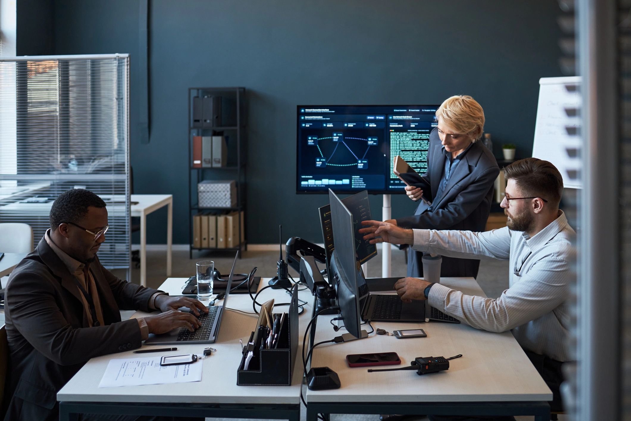 Technology team reviewing dashboards in an office