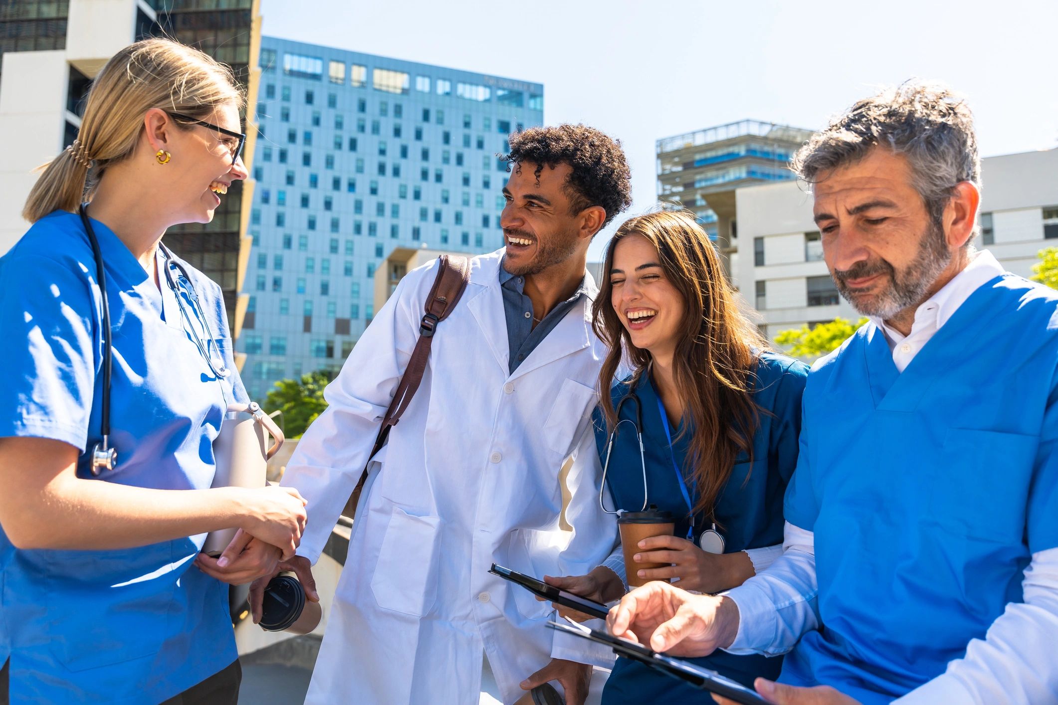 Medical professionals collaborating outdoors discussing healthcare plans