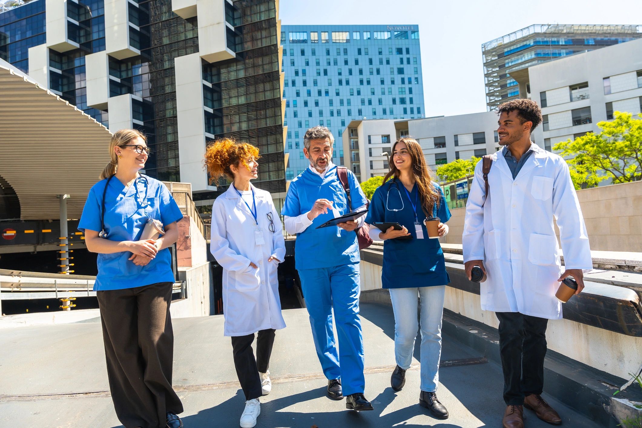 Healthcare professionals collaborating outside a hospital